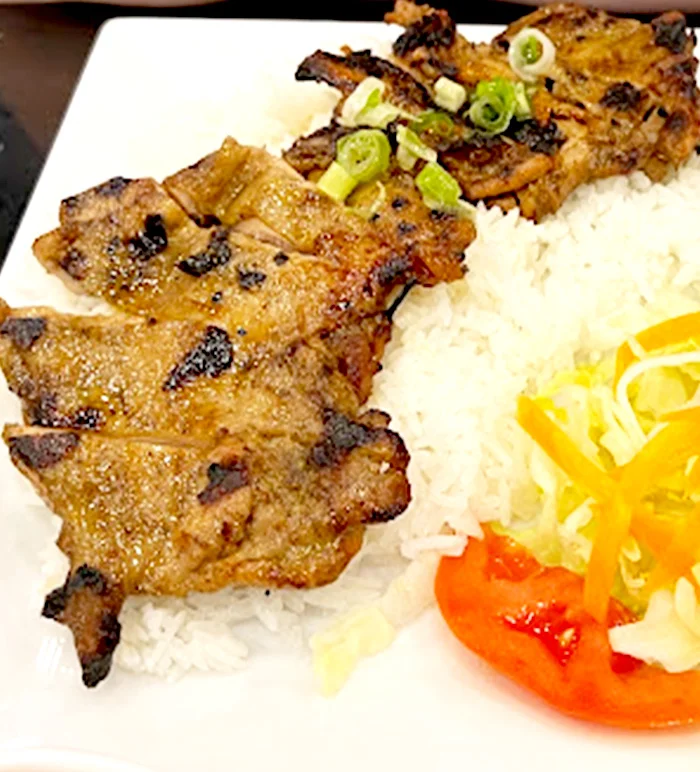 Grilled pork served over broken rice